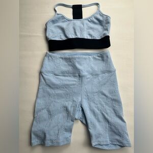 Noli Sky Blue Sports Bra and biker shorts set with black accent. Size S/M
